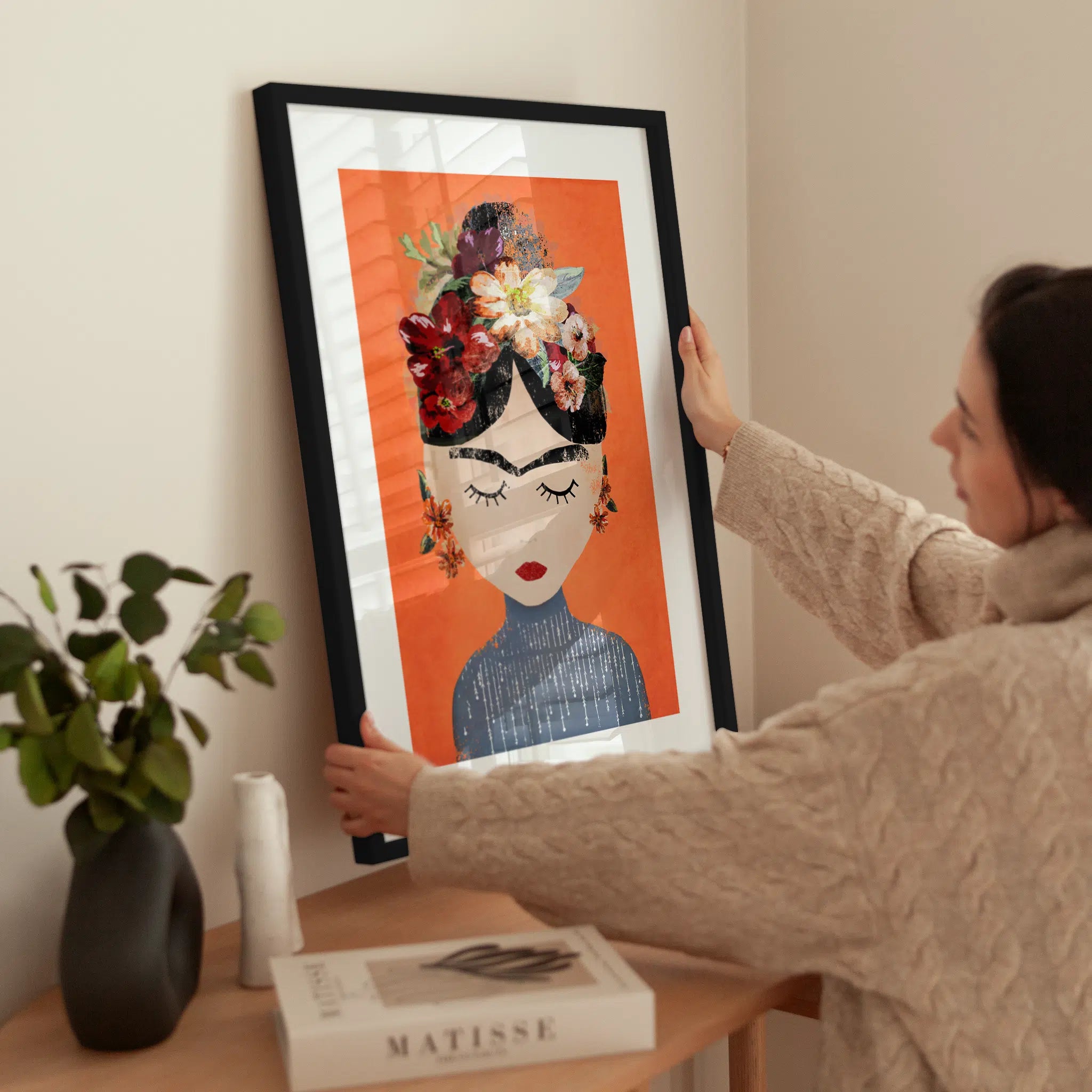 Orange Frida wird aufgehängt