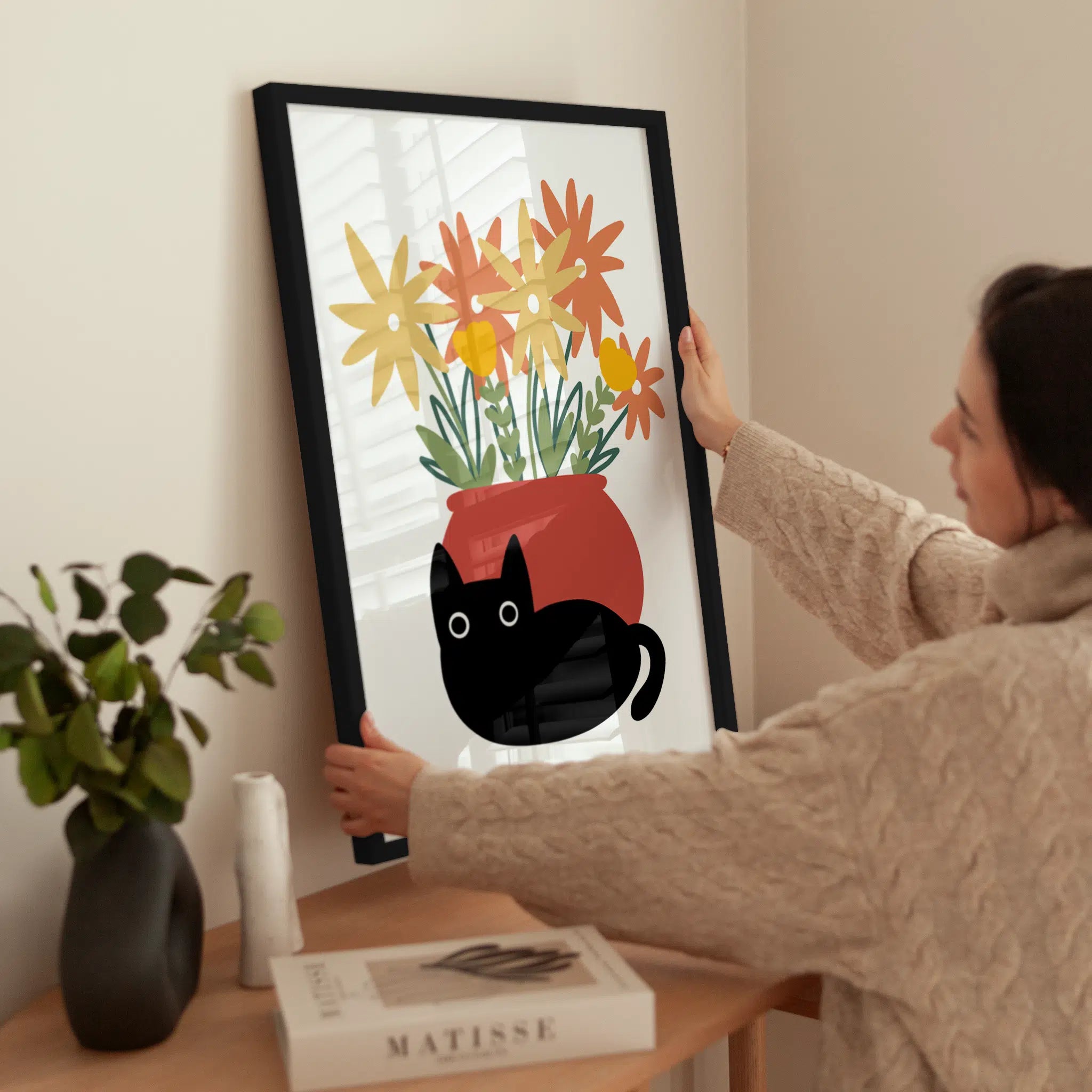 Cat & Flowers wird aufgehängt