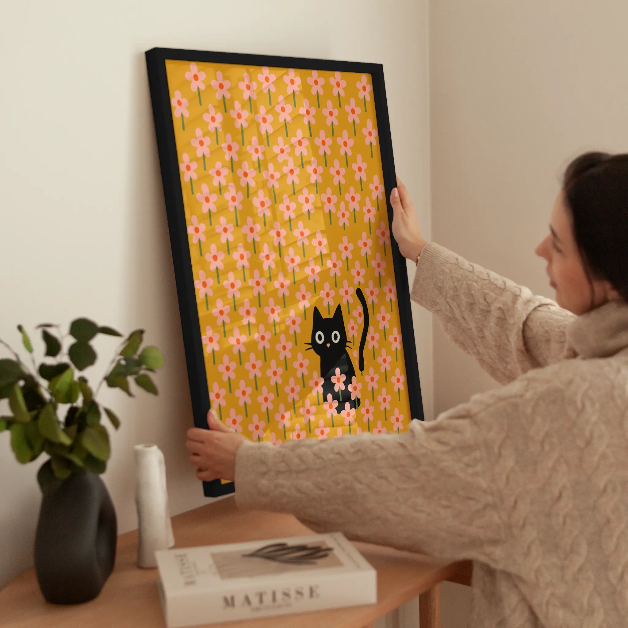 Cat in Flowers wird aufgehängt