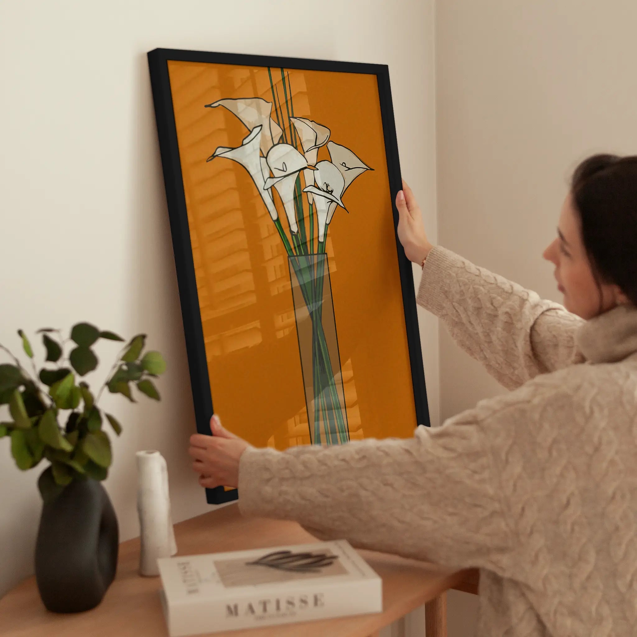 Orange Calla Lilies wird aufgehängt