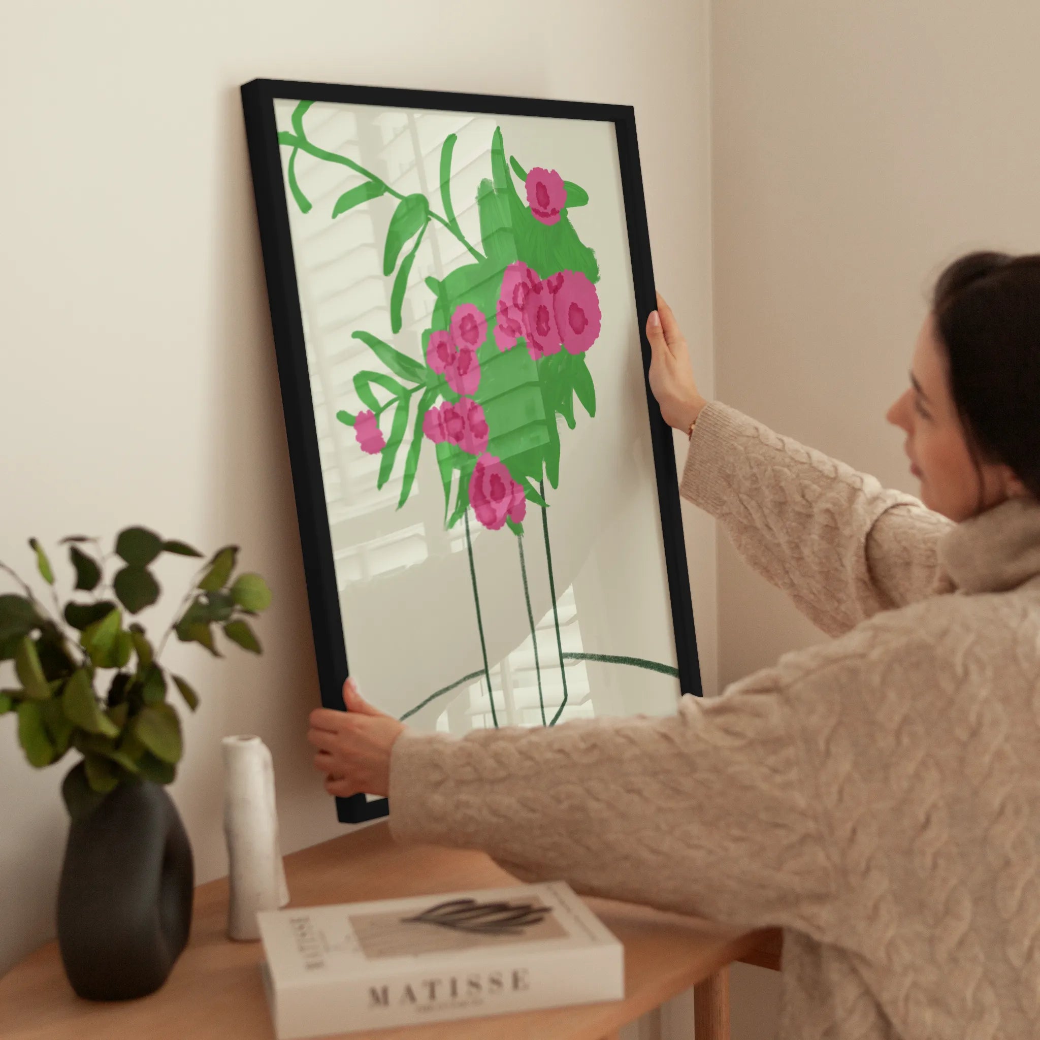 Pink Blossoms in Vase wird aufgehängt