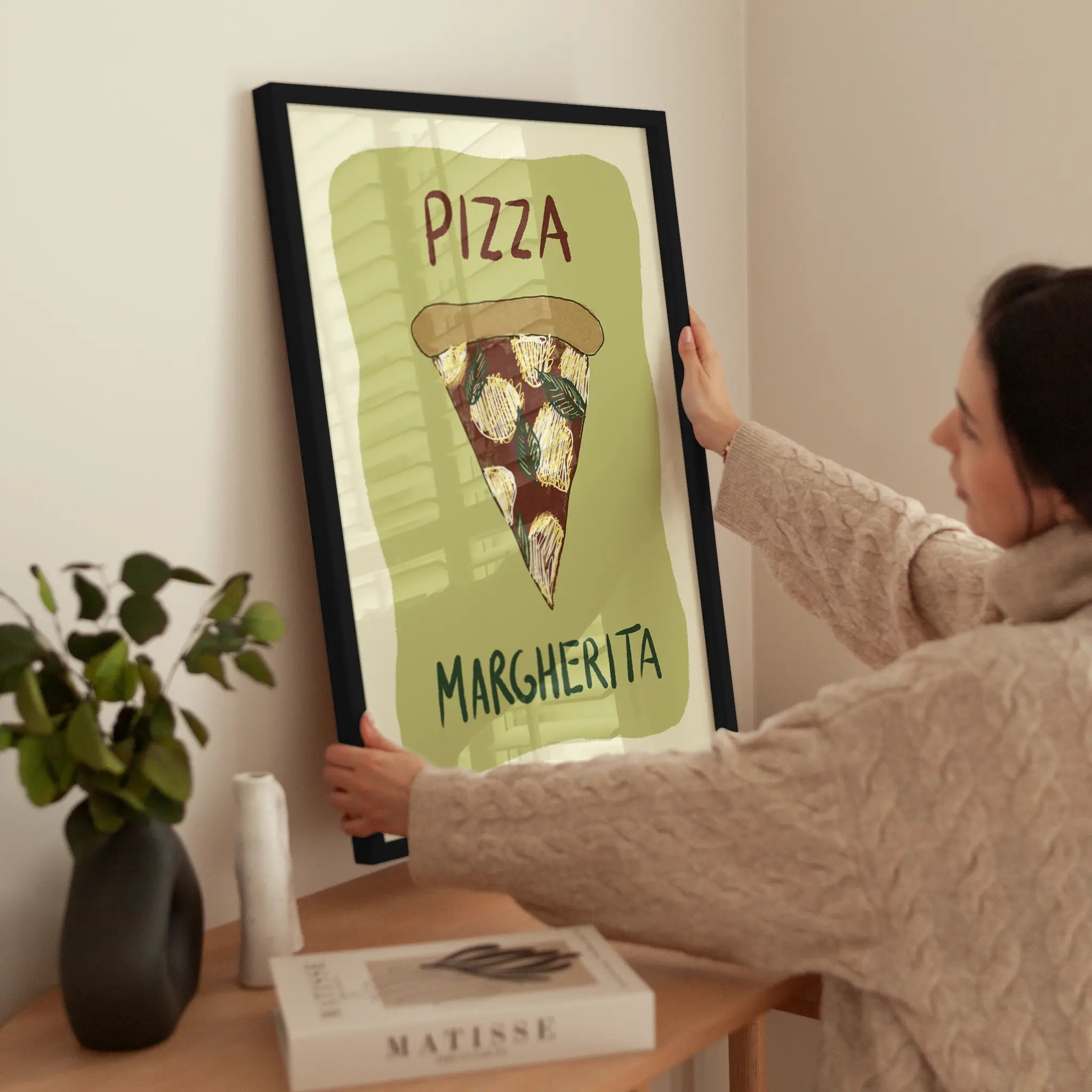 Pizza Margherita wird aufgehängt