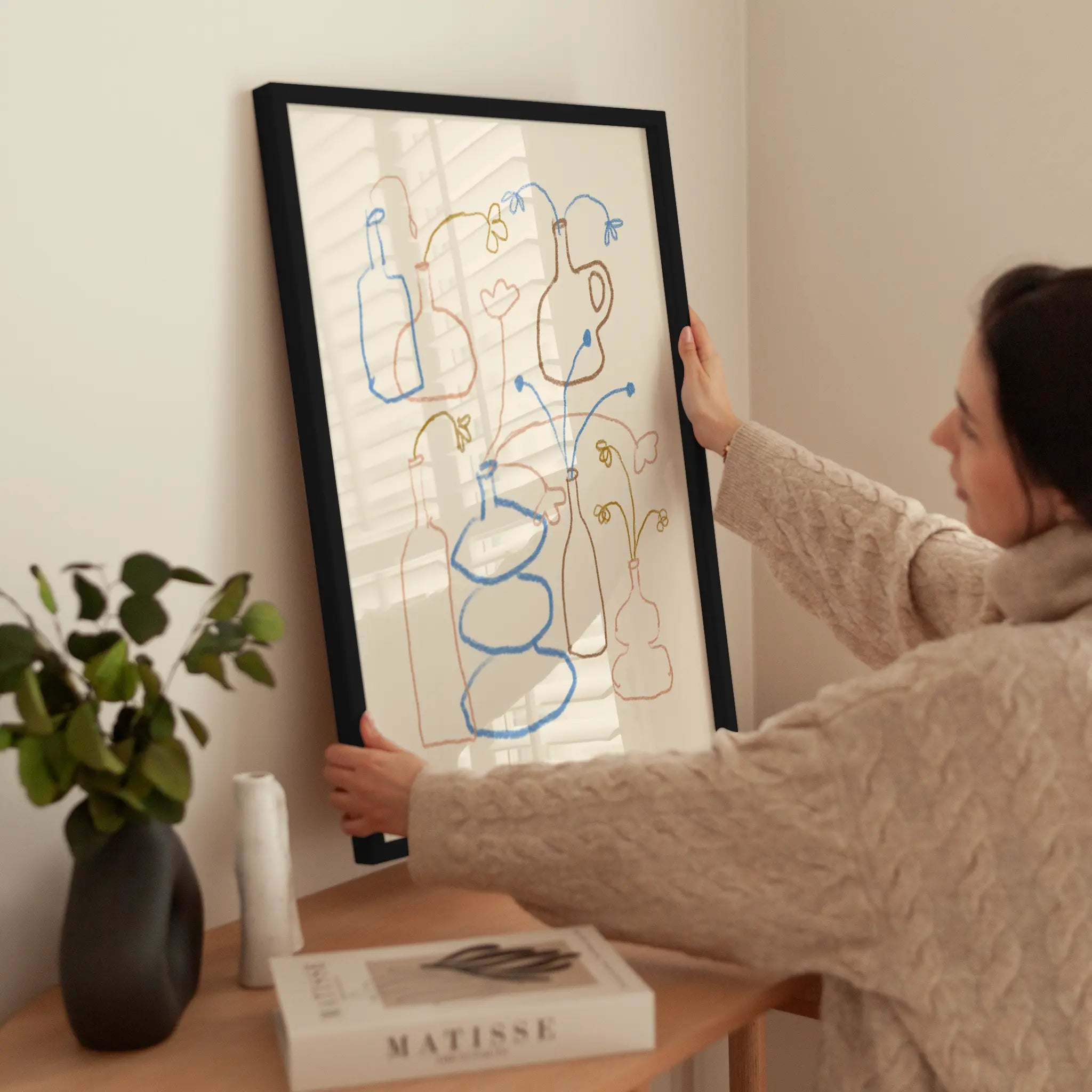 Vases and Flowers wird aufgehängt