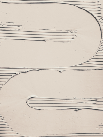 Beiges Gipsmuster mit wellenförmigem Design.