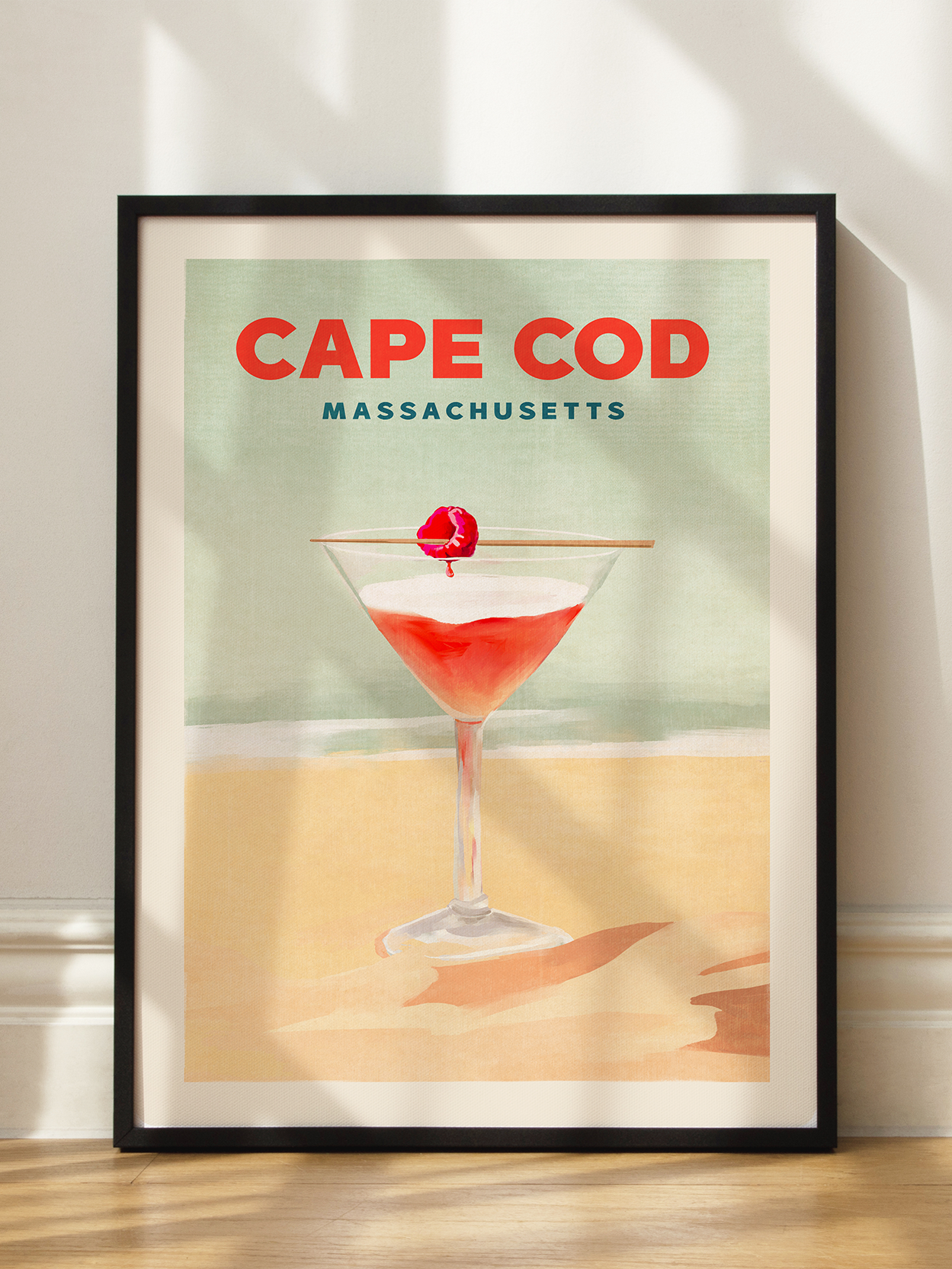 Grafik eines roten Cocktails mit einer Kirsche am Strand und dem Text "Cape Cod Massachusetts".