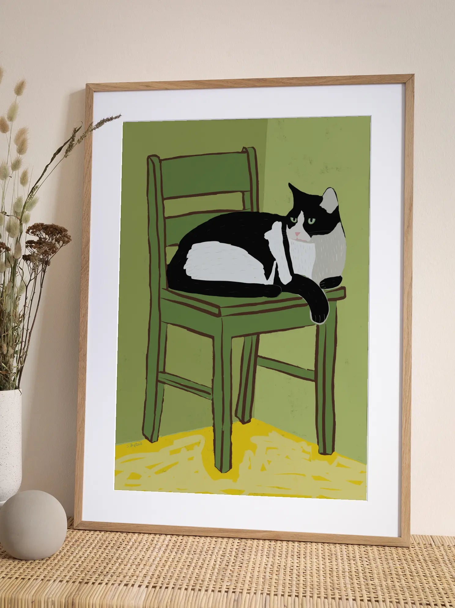 Cat On Green Chair Poster