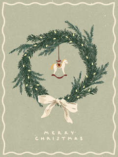 Weihnachtskranz mit Schaukelpferd und der Aufschrift "Merry Christmas".