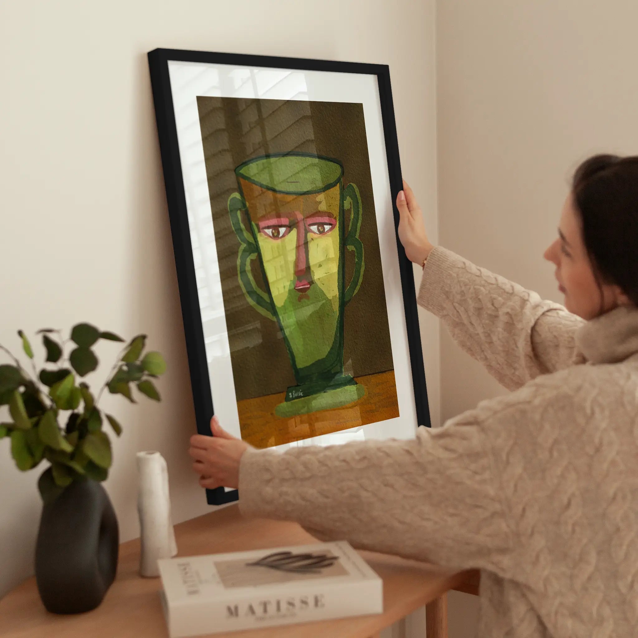 Face Vase wird aufgehängt