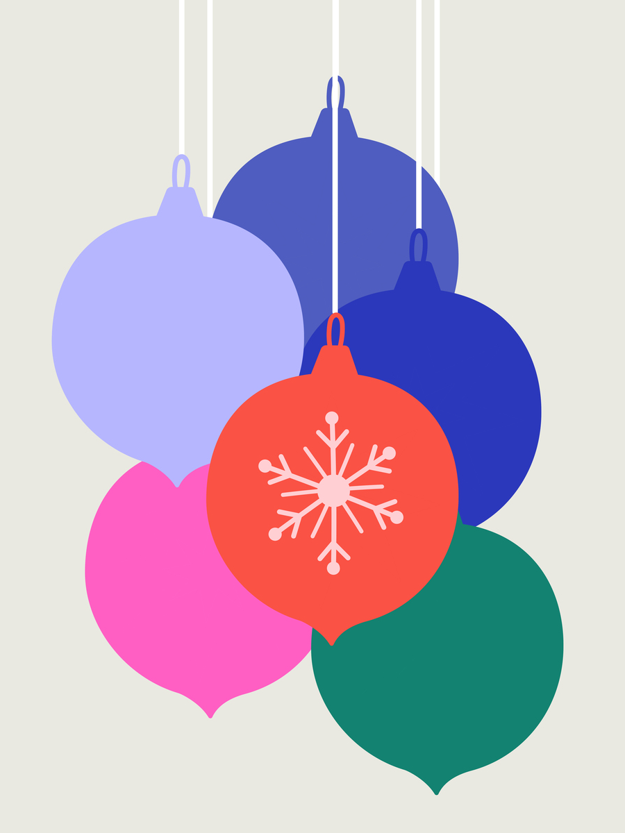 Bunte Weihnachtsornamente mit einem weißen Schneeflocken-Muster.