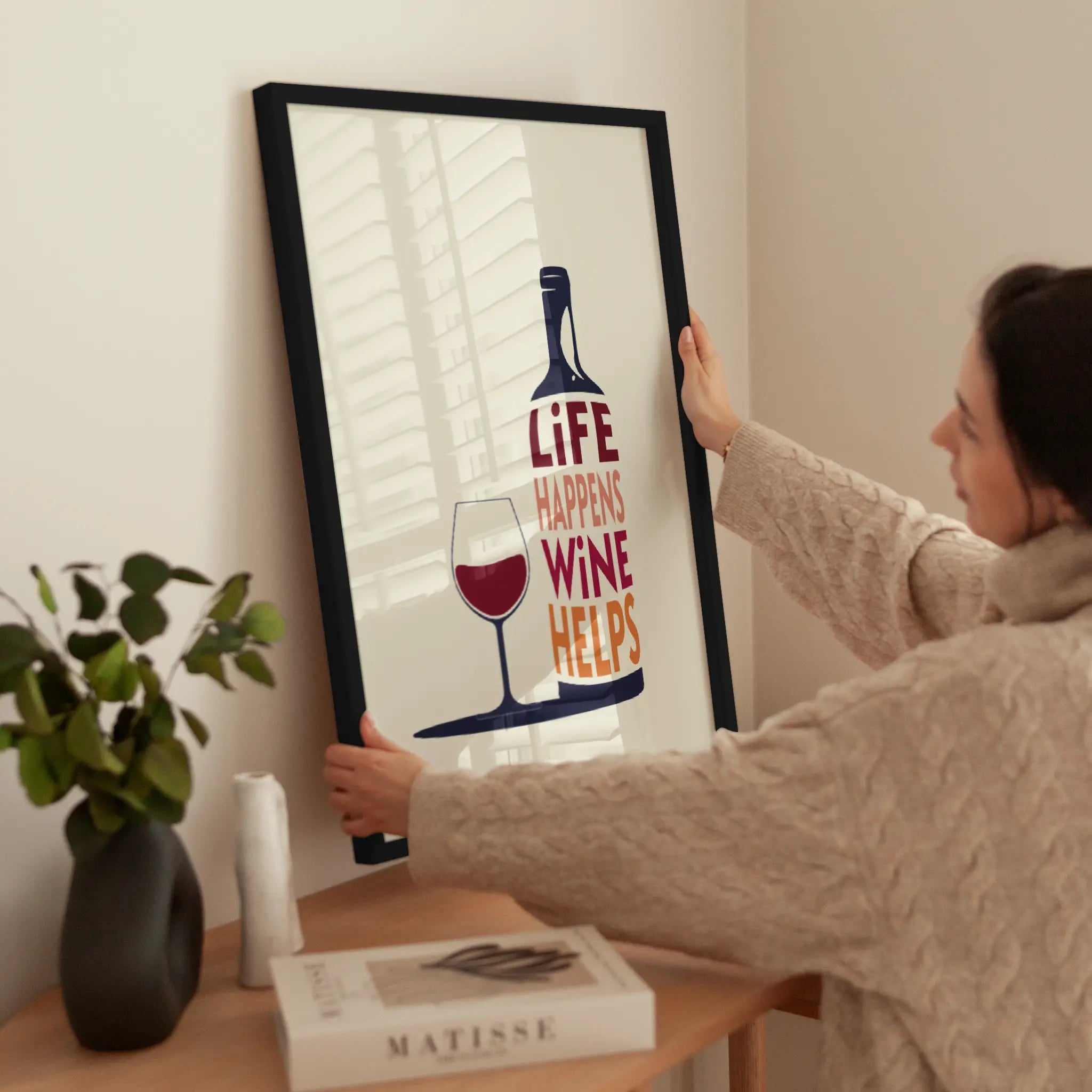 Life Happens Wine Helps wird aufgehängt