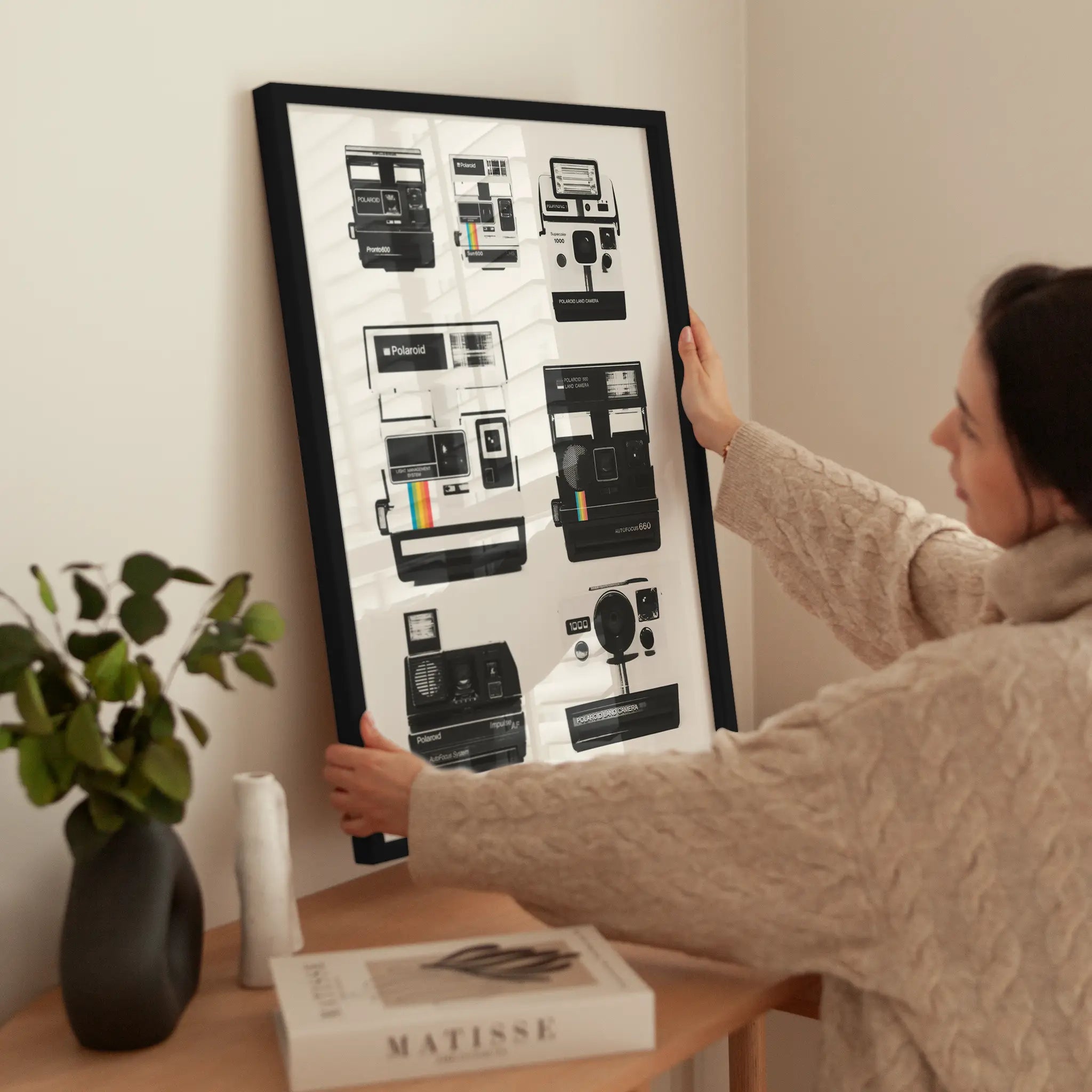 Polaroid Cameras wird aufgehängt