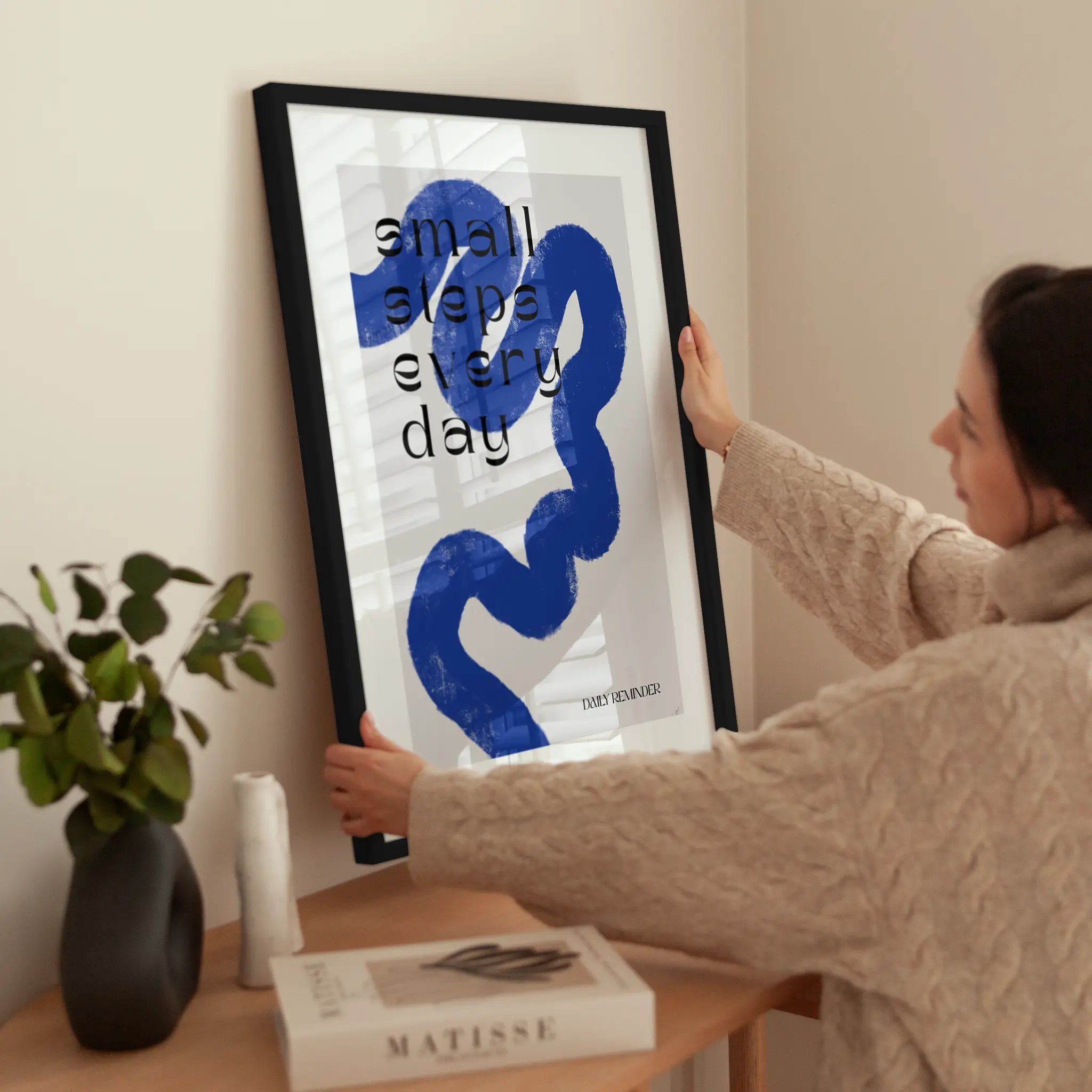 Small Steps Every Day wird aufgehängt