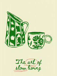 Illustration eines grünen Krugs und einer Tasse mit Blumenmuster, darunter der Text "The art of slow living".