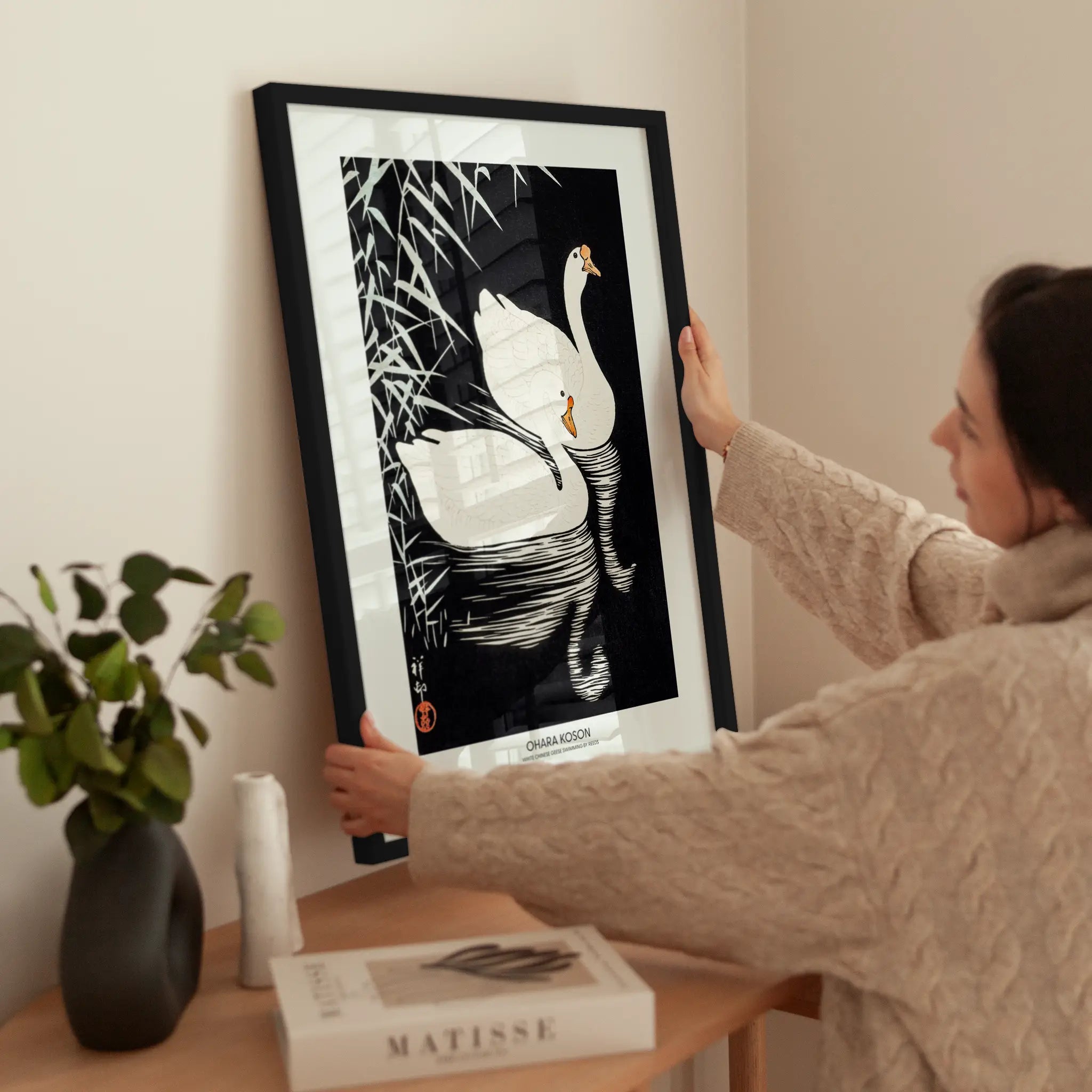 White Chinese Geese wird aufgehängt