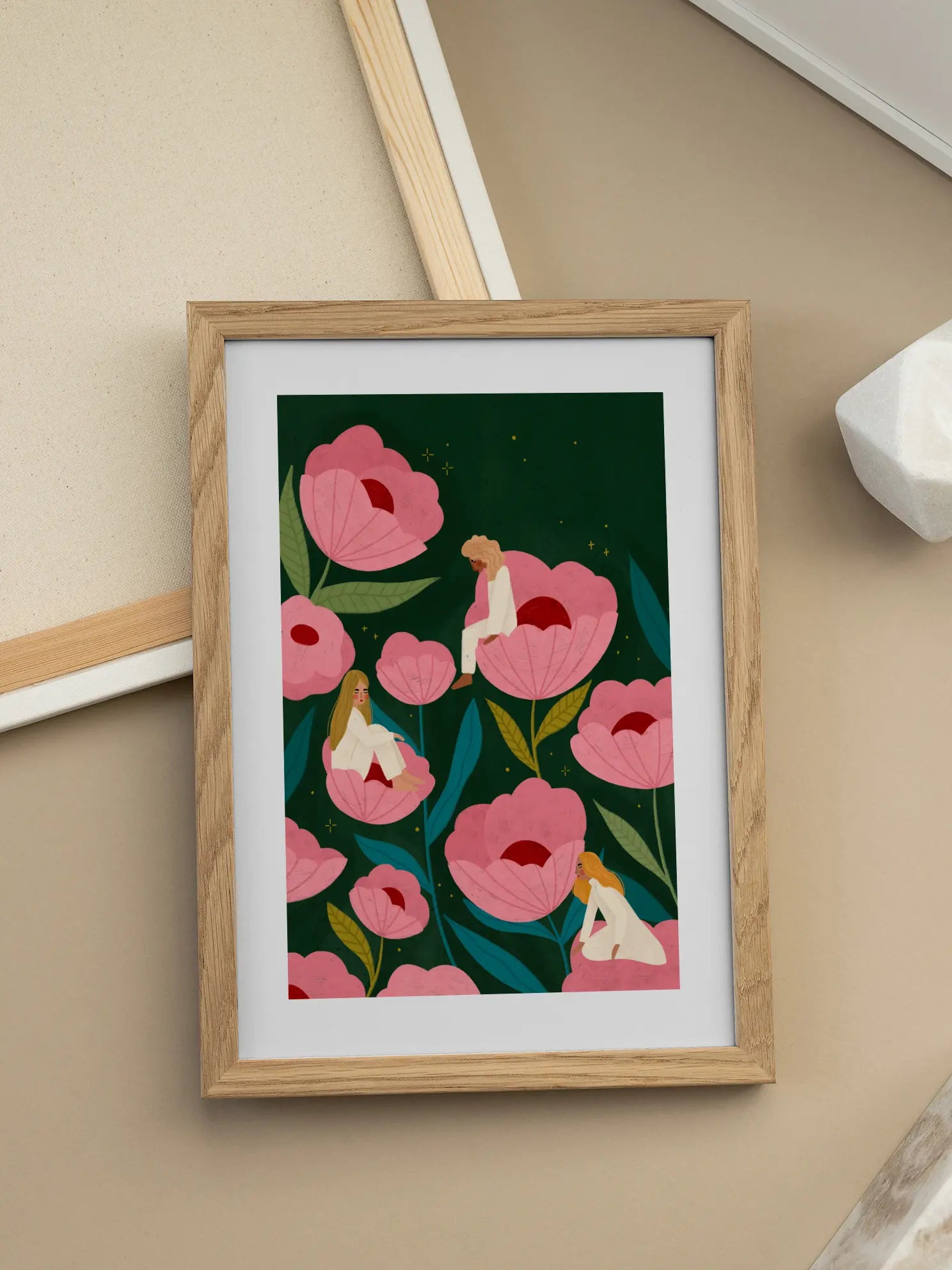 Three Women Sitting on Large Pink Flowers Poster